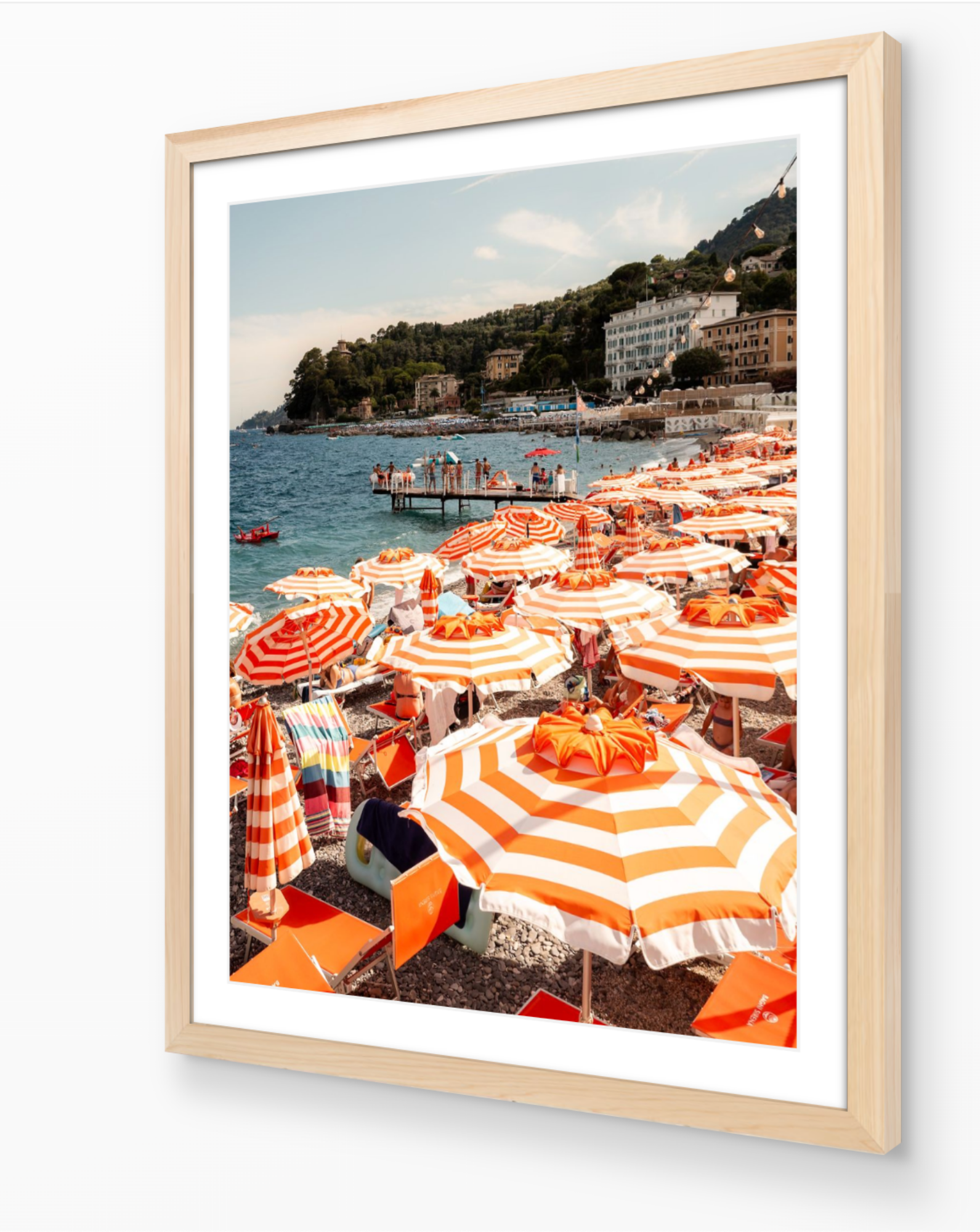 Santa Margherita beach umbrella print in oak frame — warm vertical Italian Riviera fine-art wall piece by Sam Smeaton.