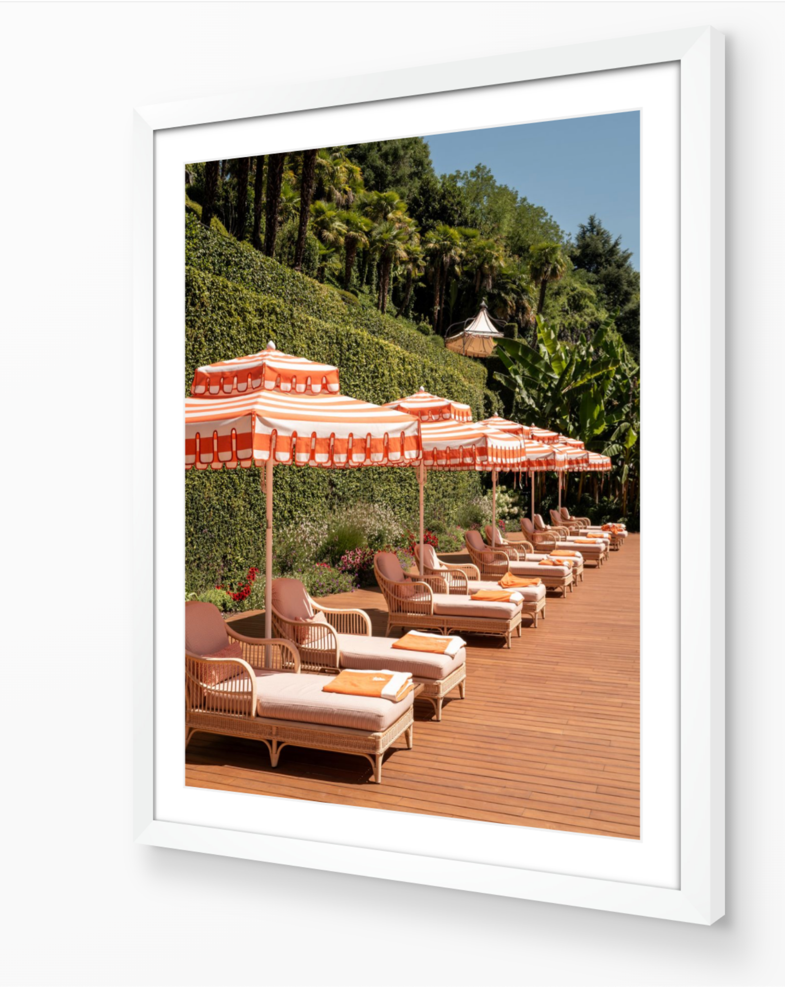 Sun Loungers of Tremezzo fine-art print by Sam Smeaton — Lake Como poolside scene framed in white for a crisp, modern resort aesthetic.