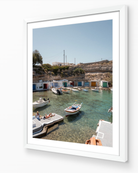 Mandrakia II – Milos fine-art print in white frame by Sam Smeaton — Greek island photography of boats anchored in crystal-clear water, Milos Greece