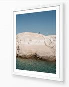 Sarakiniko II – Milos fine-art print in white frame by Sam Smeaton — textured white stone landscape and crystal-clear water from the Cyclades