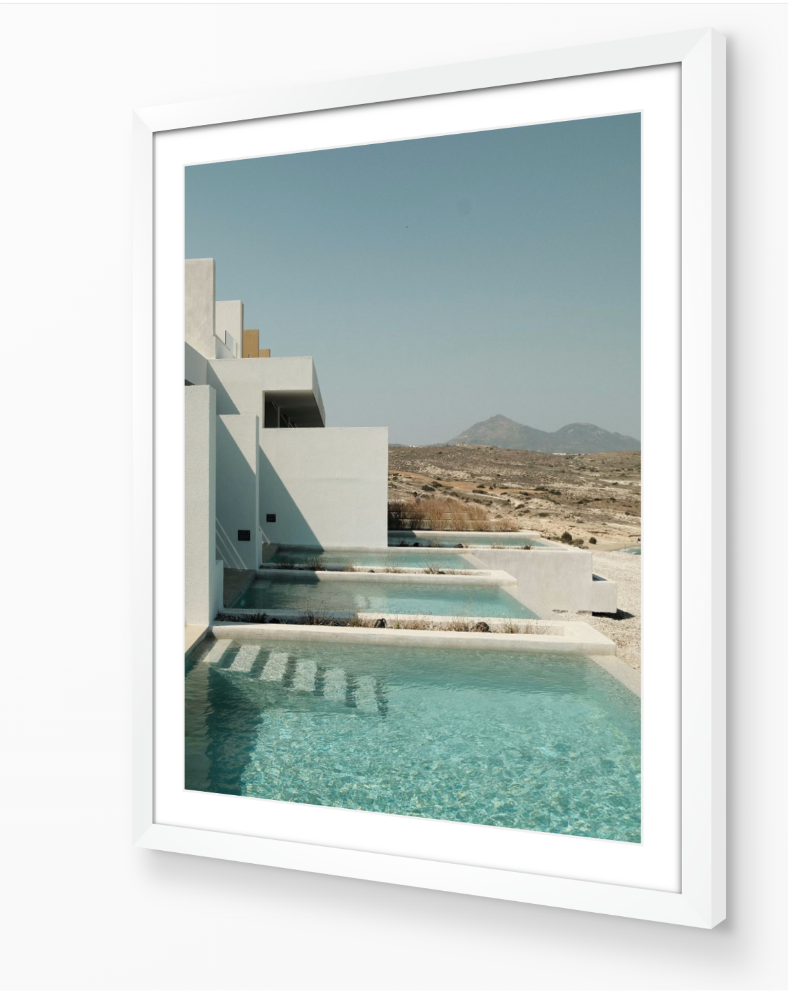 Private Pools – Milos fine-art print in white frame by Sam Smeaton — Cycladic architecture photography from Milos Greece