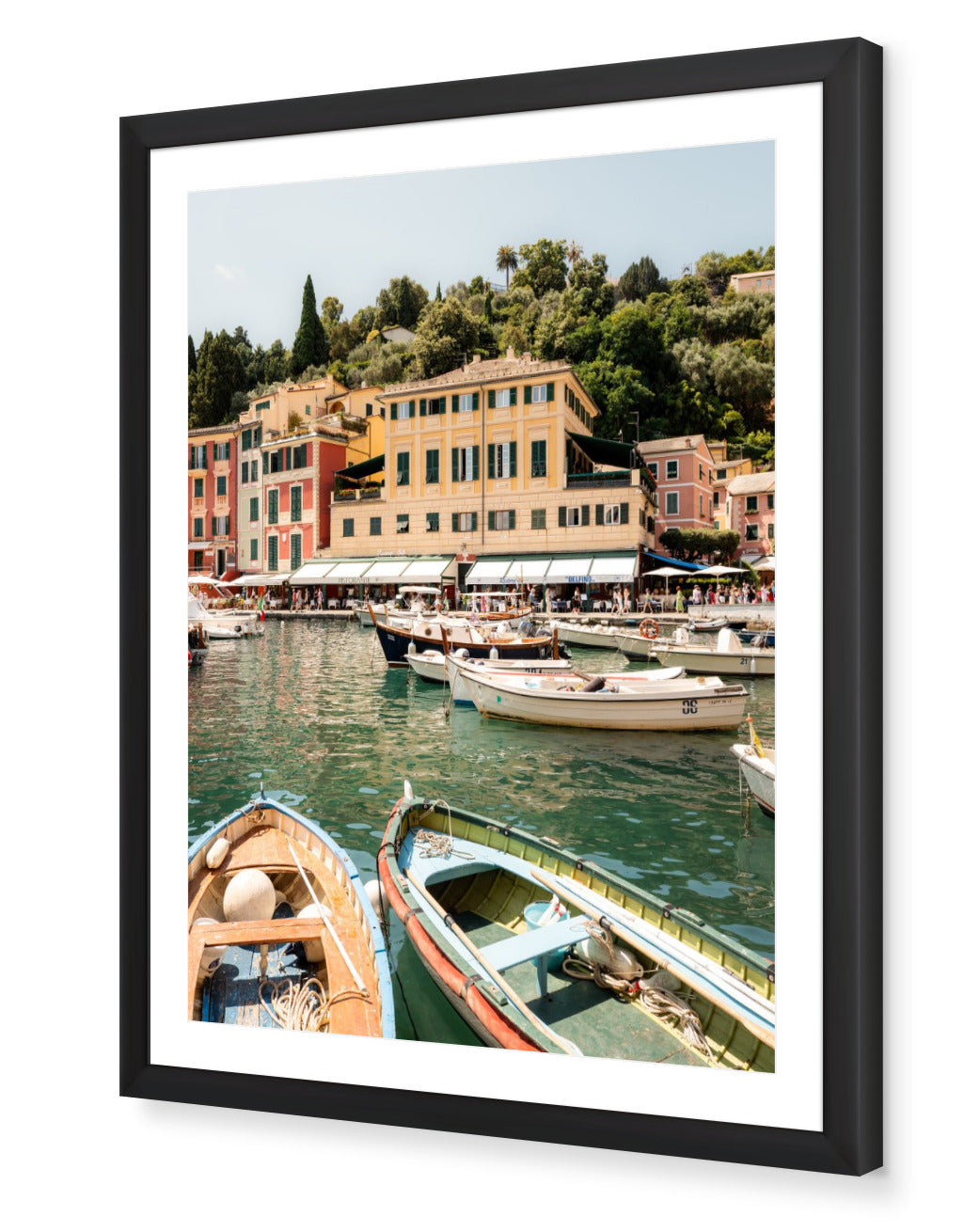 Portofino I fine-art print by Sam Smeaton — Italian Riviera boats and pastel harbour framed in black for elegant coastal contrast.
