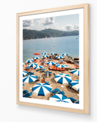 Azure Umbrellas framed print in oak wood frame – Italian Riviera coastal photography