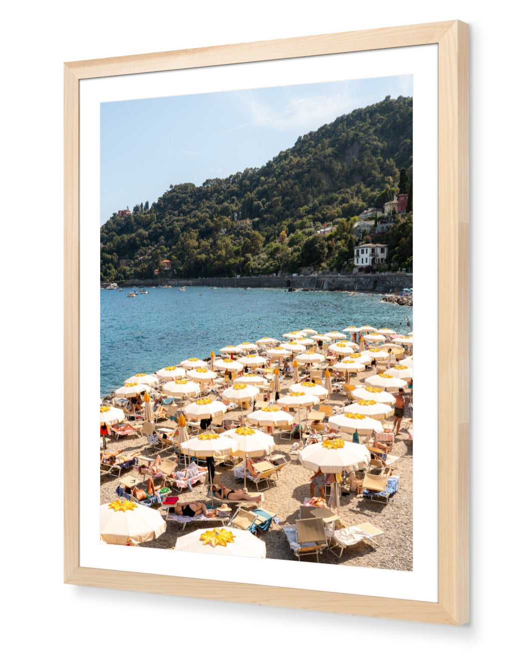 Santa Margherita fine-art print by Sam Smeaton — Italian Riviera beach scene with golden umbrellas and sparkling blue sea, framed in natural oak for warm Mediterranean tones.