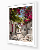 Paros Bougainvillea Lane fine-art print in white frame by Sam Smeaton — Mediterranean photography with bougainvillea and white stone lanes
