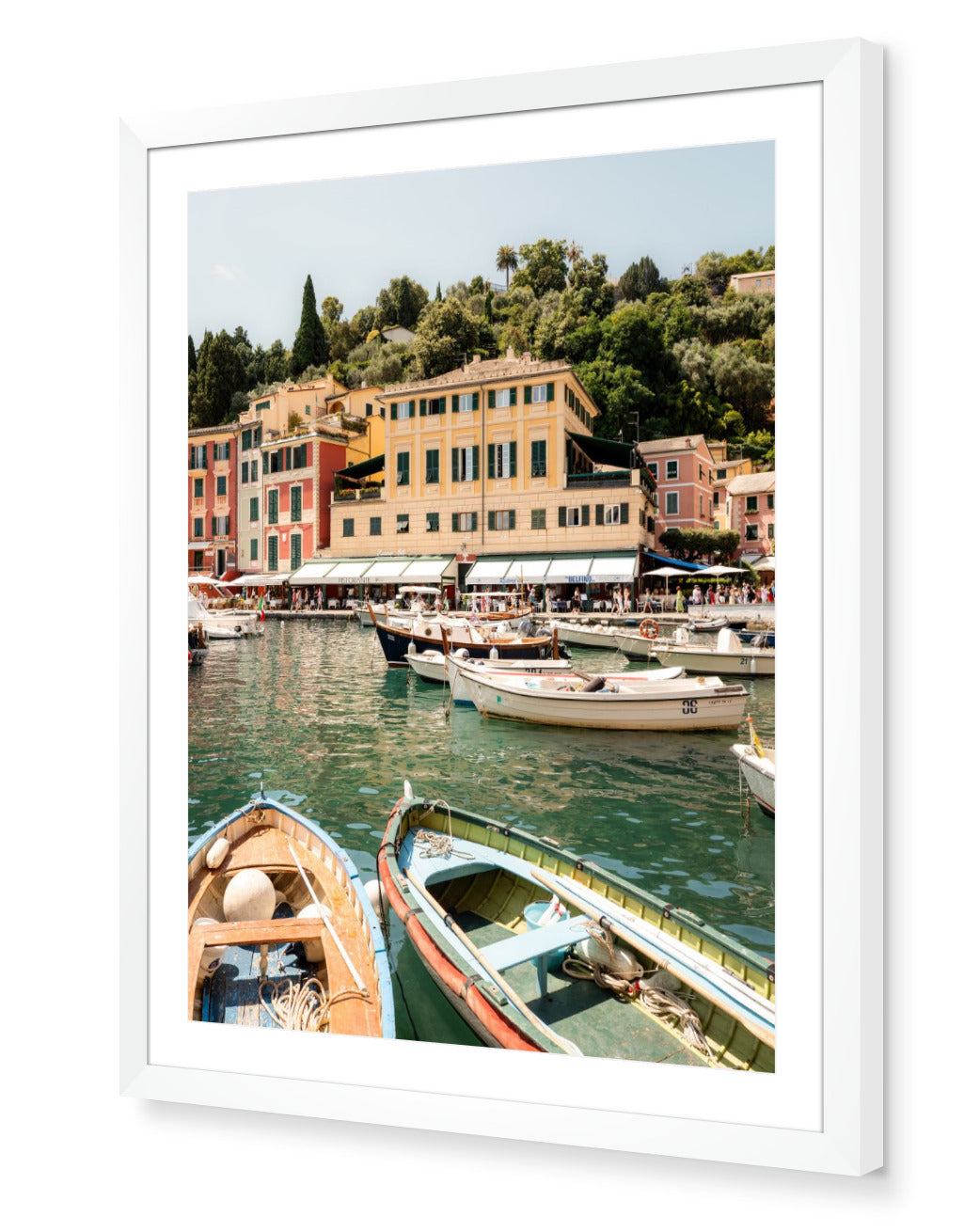 Portofino I fine-art print by Sam Smeaton — Mediterranean harbour with soft pastel façades and boats, framed in modern white for a clean gallery finish.