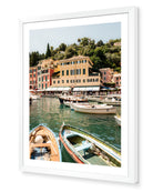 Portofino I fine-art print by Sam Smeaton — Mediterranean harbour with soft pastel façades and boats, framed in modern white for a clean gallery finish.