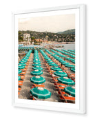 Portofino Beach Club fine-art print by Sam Smeaton — turquoise and terracotta tones along Portofino’s coast, framed in white for a refined coastal gallery finish.
