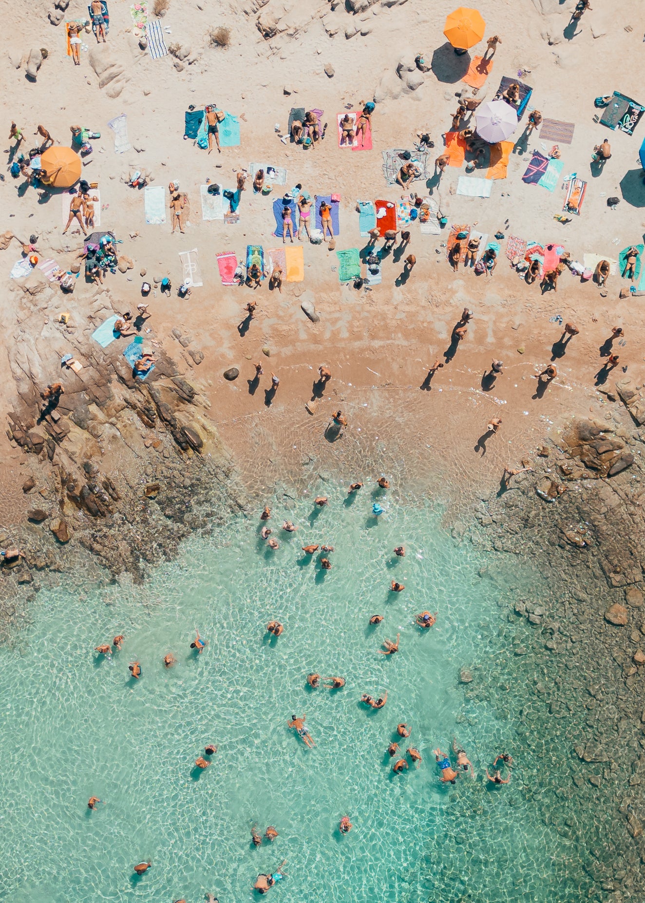 Fine-art photography print of Costa Smeralda (Vertical Edition) by Sam Smeaton — aerial view of Sardinia’s turquoise waters, umbrellas, and granite coastline, printed on premium matte fine-art paper, 40 × 60 cm.