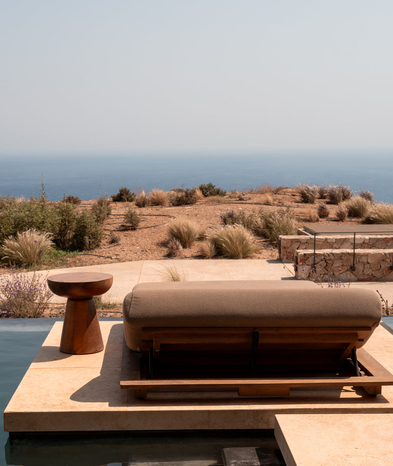 Luxury architectural photography of stone terrace and sea horizon in the Greek Islands.