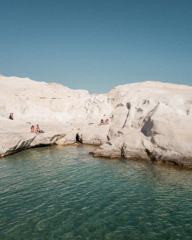 Sarakiniko I – Milos fine-art print by Sam Smeaton — white volcanic cliffs and turquoise Aegean sea under clear Cycladic sky