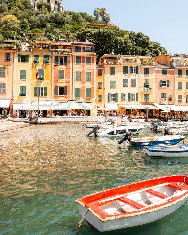 Fine-art photography print of Portofino II by Sam Smeaton — terracotta façades, red boats and Mediterranean reflections on the Italian Riviera, printed on premium matte fine-art paper, 50 × 75 cm.