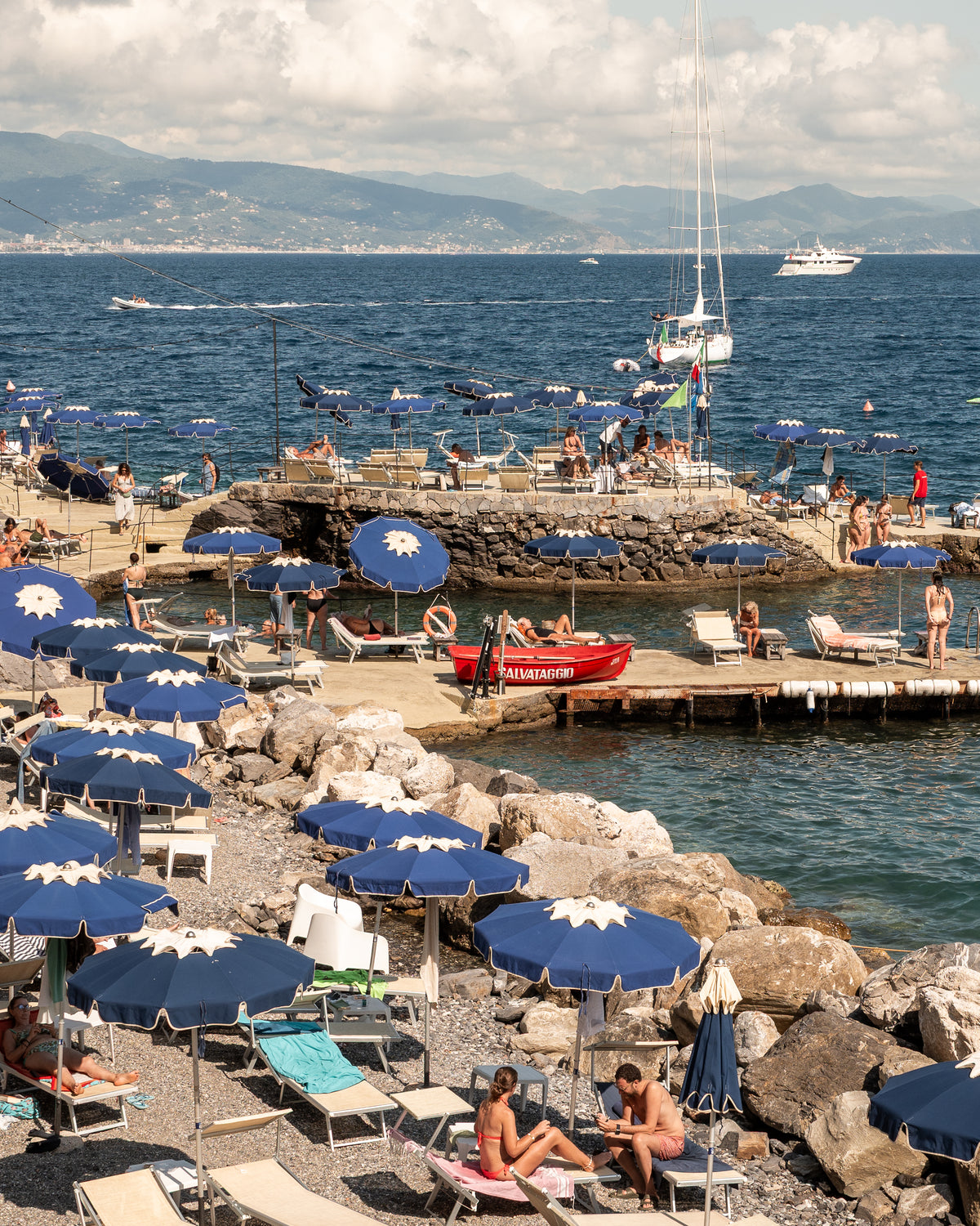 Fine-art photography print of Santa Margherita by Sam Smeaton — blue umbrellas and Mediterranean sea, Italian Riviera wall art printed on premium matte paper, 20×30 inches