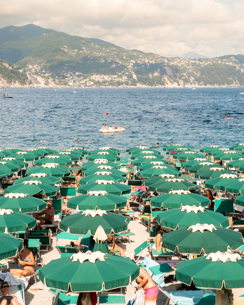 Fine-art photography print of Santa Margherita by Sam Smeaton — green umbrellas along the Ligurian Sea, Italian Riviera coastal wall art printed on archival matte paper.