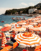 Vertical fine-art photography print of Santa Margherita beach umbrellas by Sam Smeaton — vibrant orange tones along the Italian Riviera.