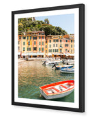 Portofino II fine-art print by Sam Smeaton — golden Italian harbour buildings and red boats, framed in black for striking coastal depth and elegance.