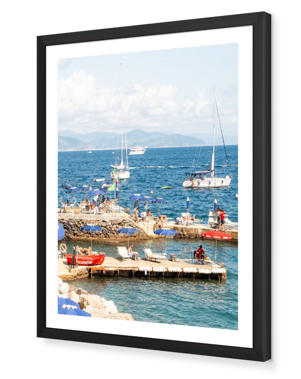 Santa Margherita fine-art print by Sam Smeaton — Italian Riviera umbrellas and red lifeguard boat, framed in classic black for bold coastal contrast.