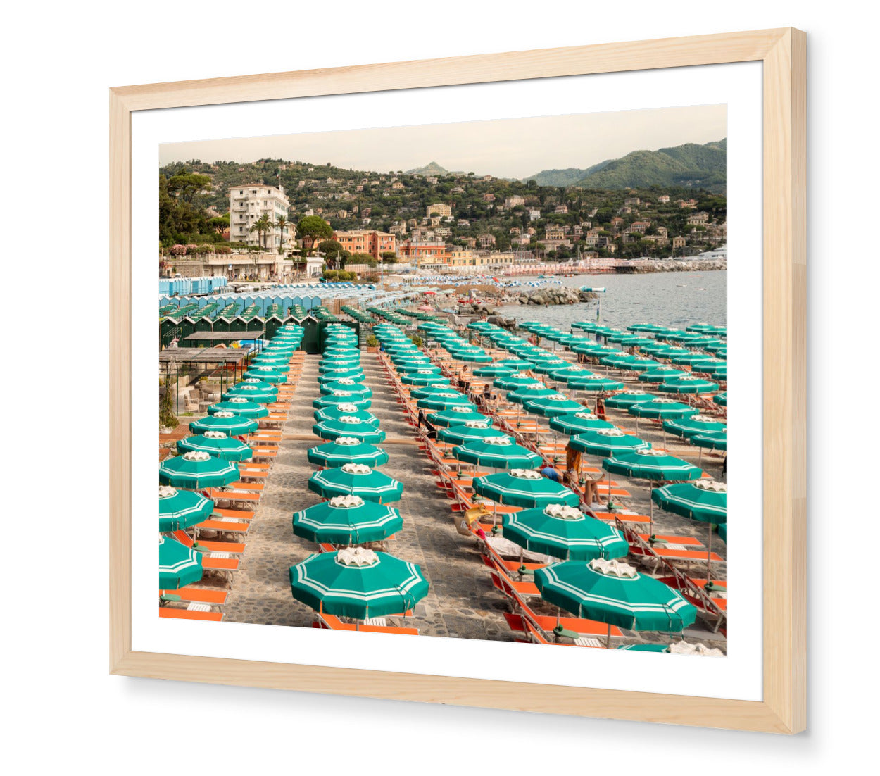 Portofino Beach Club fine-art print by Sam Smeaton — turquoise umbrellas and Italian sunbeds, framed in natural oak for warm, timeless Riviera elegance.