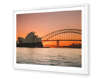 Opera House and Harbour Bridge at Sunset fine-art print in white frame by Sam Smeaton — tranquil Sydney sunset with calm water, pastel sky, and iconic landmarks