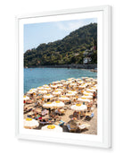 Santa Margherita fine-art print by Sam Smeaton — golden parasols and turquoise Mediterranean water, framed in bright white for a clean coastal finish.